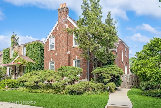 1823 N Newland Ave, Chicago, IL 60707 - view of home's exterior featuring a chimney and brick siding