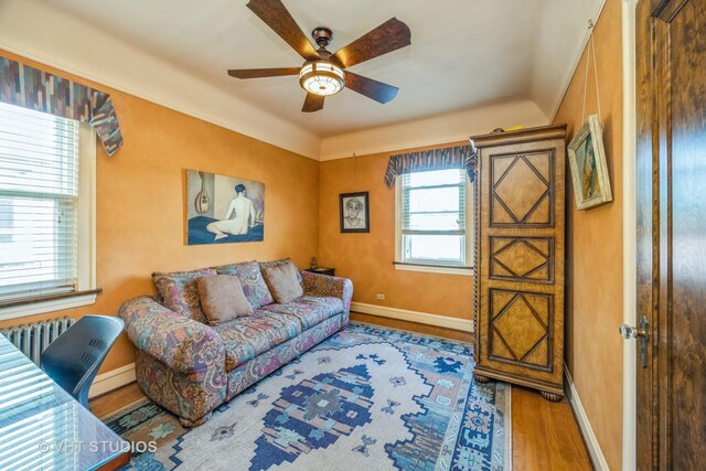 1823 N Newland Ave, Chicago, IL 60707 - living area featuring wood finished floors, radiator heating unit, and ceiling fan