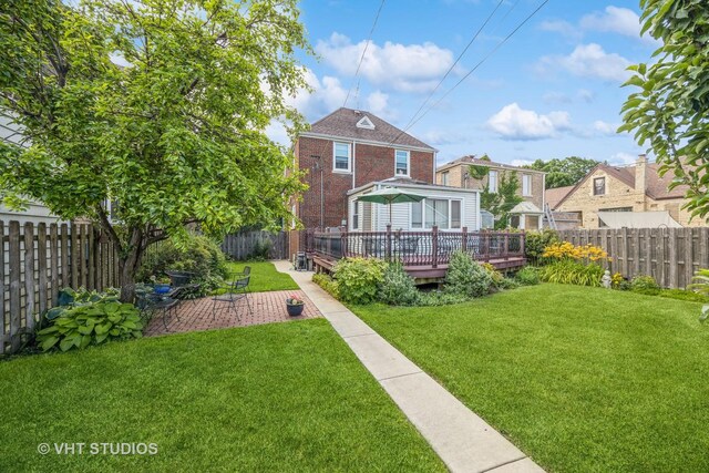 1823 N Newland Ave, Chicago, IL 60707 - back of property with a fenced backyard, a deck, and a patio