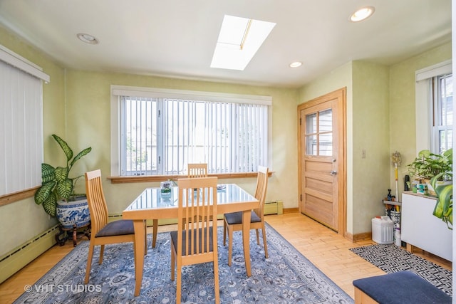1823 N Newland Ave, Chicago, IL 60707 - dining room featuring a baseboard heating unit, a skylight, and recessed lighting
