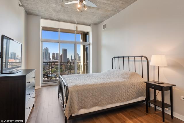 700 N Larrabee St Unit 1111, Chicago, IL 60654 - bedroom with dark wood-type flooring and a view of skyline