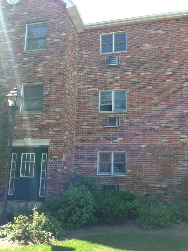 4305 W Shamrock Ln Unit 2F, Mchenry, IL 60050 - view of property exterior with brick siding