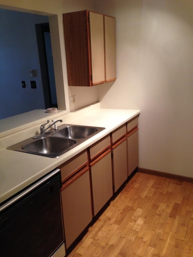 4305 W Shamrock Ln Unit 2F, Mchenry, IL 60050 - kitchen featuring black dishwasher, light wood-style floors, and light countertops