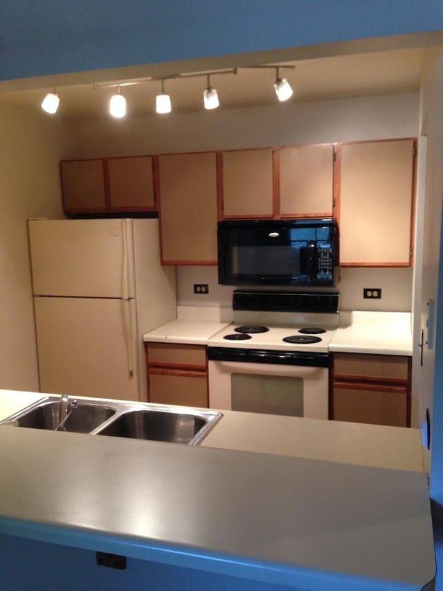 4305 W Shamrock Ln Unit 2F, Mchenry, IL 60050 - kitchen with white appliances and a sink