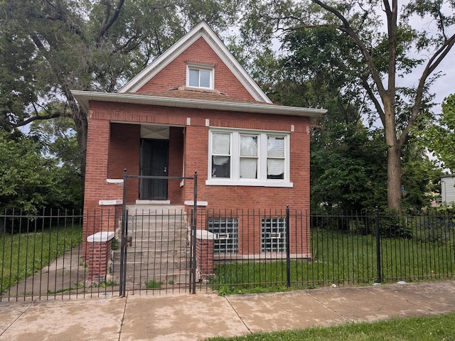 7017 S Hermitage Ave, Chicago, IL 60636 - bungalow-style home with brick siding and a fenced front yard