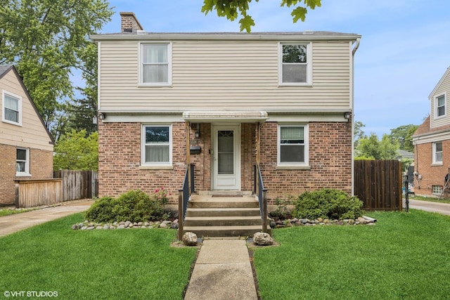 1316 Heidorn Ave, Westchester, IL 60145 - colonial-style house with brick siding and a chimney