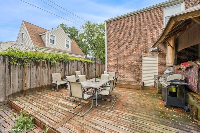 1316 Heidorn Ave, Westchester, IL 60145 - wooden terrace with area for grilling, outdoor dining space, and a fenced backyard