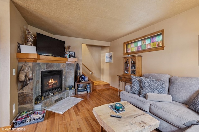 1316 Heidorn Ave, Westchester, IL 60145 - living area with wood finished floors, a fireplace, and a textured ceiling