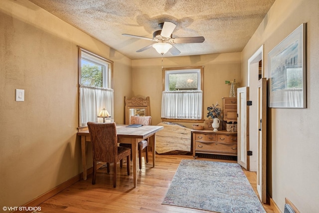 1316 Heidorn Ave, Westchester, IL 60145 - dining space with ceiling fan, light wood-style floors, and a textured ceiling