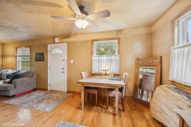 1316 Heidorn Ave, Westchester, IL 60145 - dining space with a textured ceiling, light wood-type flooring, and a ceiling fan