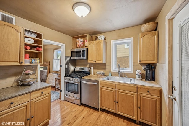 1316 Heidorn Ave, Westchester, IL 60145 - kitchen featuring stainless steel appliances, light wood-style floors, open shelves, and light countertops