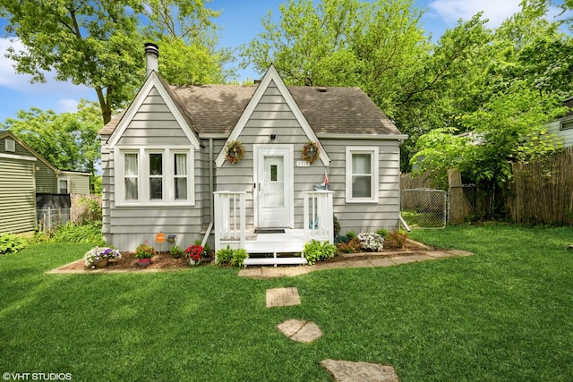 7718 Beach Rd, Wonder Lake, IL 60097 - view of front of property with a shingled roof and a chimney