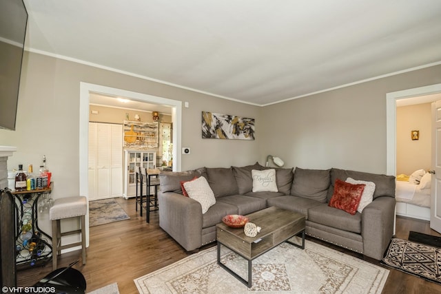 7718 Beach Rd, Wonder Lake, IL 60097 - living area featuring wood finished floors and ornamental molding