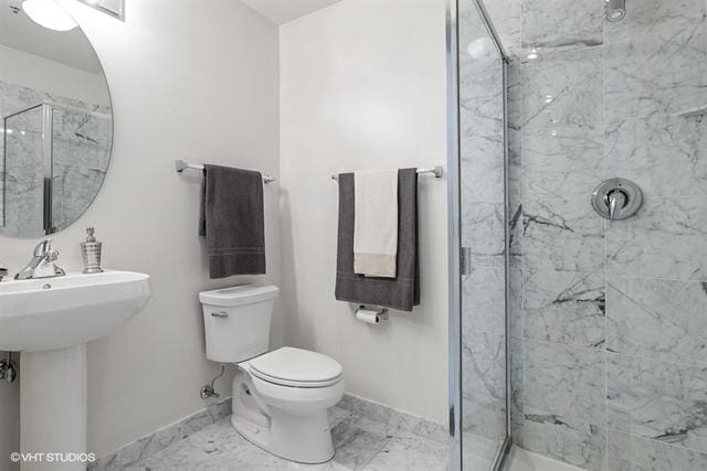 330 W Grand Ave Unit 2106, Chicago, IL 60654 - bathroom featuring a marble finish shower and marble look tile flooring