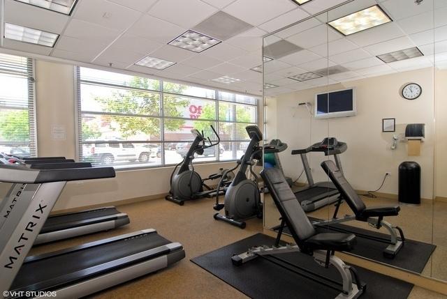 330 W Grand Ave Unit 2106, Chicago, IL 60654 - exercise room featuring baseboards and a drop ceiling