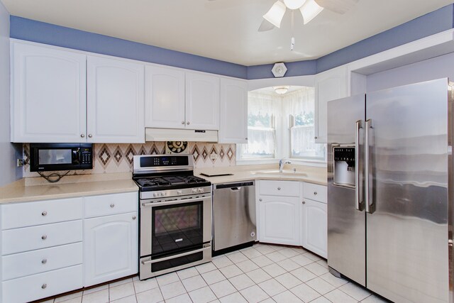 6444 N Oketo Ave, Chicago, IL 60631 - kitchen with stainless steel appliances, under cabinet range hood, and white cabinetry