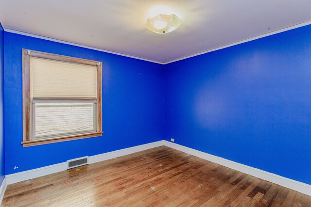 6444 N Oketo Ave, Chicago, IL 60631 - spare room featuring crown molding and wood finished floors