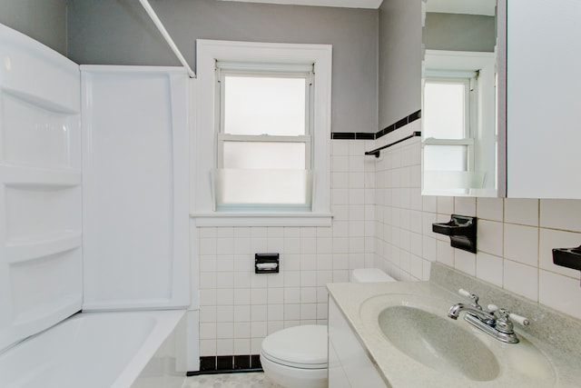 6444 N Oketo Ave, Chicago, IL 60631 - bathroom with tile walls, vanity, and bathtub / shower combination