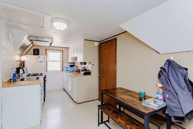 6444 N Oketo Ave, Chicago, IL 60631 - kitchen with white appliances, light countertops, white cabinets, light floors, and backsplash
