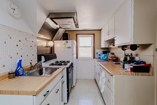 6444 N Oketo Ave, Chicago, IL 60631 - kitchen with range with gas stovetop, light countertops, white cabinetry, decorative backsplash, and light floors