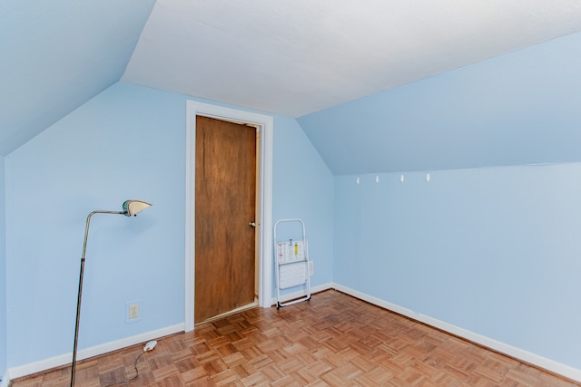 6444 N Oketo Ave, Chicago, IL 60631 - additional living space with baseboards and vaulted ceiling