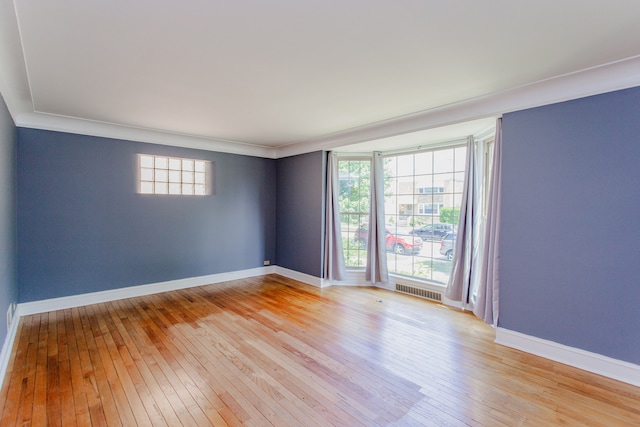 6444 N Oketo Ave, Chicago, IL 60631 - spare room featuring light wood-style flooring and ornamental molding