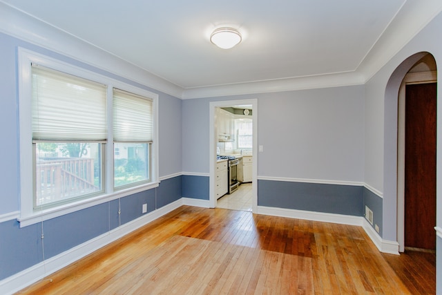 6444 N Oketo Ave, Chicago, IL 60631 - unfurnished room featuring arched walkways and light wood finished floors