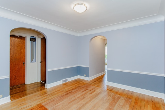 6444 N Oketo Ave, Chicago, IL 60631 - spare room with wood-type flooring and arched walkways