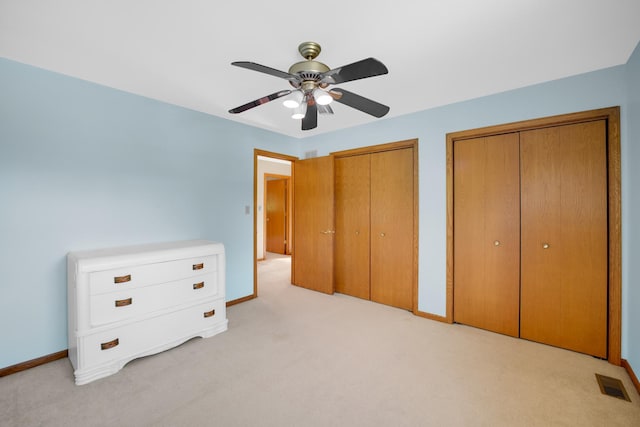 1860 Harvard Ln, New Lenox, IL 60451 - unfurnished bedroom featuring two closets, light colored carpet, and a ceiling fan
