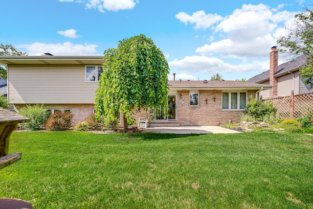 1860 Harvard Ln, New Lenox, IL 60451 - rear view of property with brick siding, a patio, and a lawn