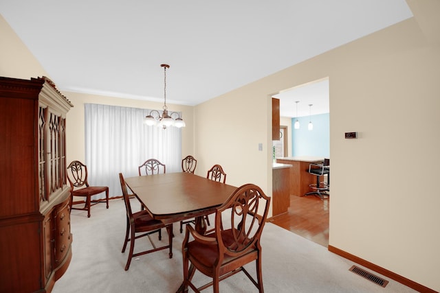 1860 Harvard Ln, New Lenox, IL 60451 - dining area featuring light carpet and a chandelier