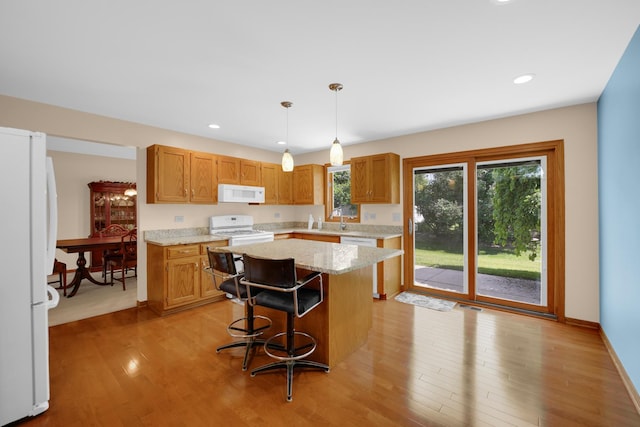 1860 Harvard Ln, New Lenox, IL 60451 - kitchen with white appliances, light wood-style flooring, decorative light fixtures, a kitchen island, and recessed lighting