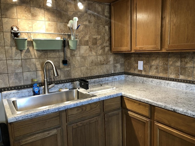 6430 S Lorel Ave, Chicago, IL 60638 - kitchen featuring decorative backsplash and brown cabinets