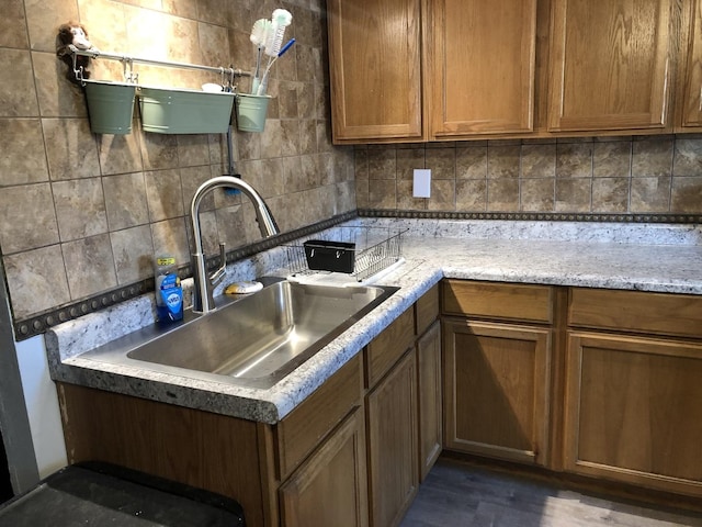 6430 S Lorel Ave, Chicago, IL 60638 - kitchen featuring backsplash, brown cabinets, and dark wood-style flooring