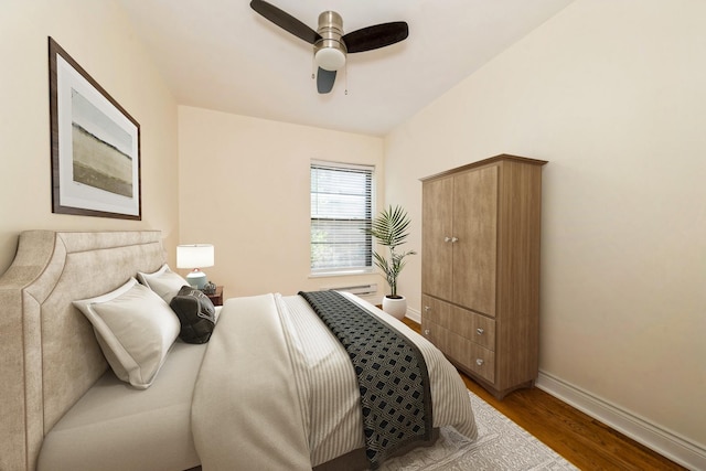 1006 E 54th St Unit J-2, Chicago, IL 60615 - bedroom with wood finished floors and ceiling fan
