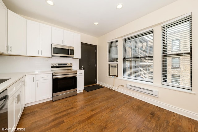 1006 E 54th St Unit J-2, Chicago, IL 60615 - kitchen featuring stainless steel appliances, light countertops, white cabinetry, and recessed lighting