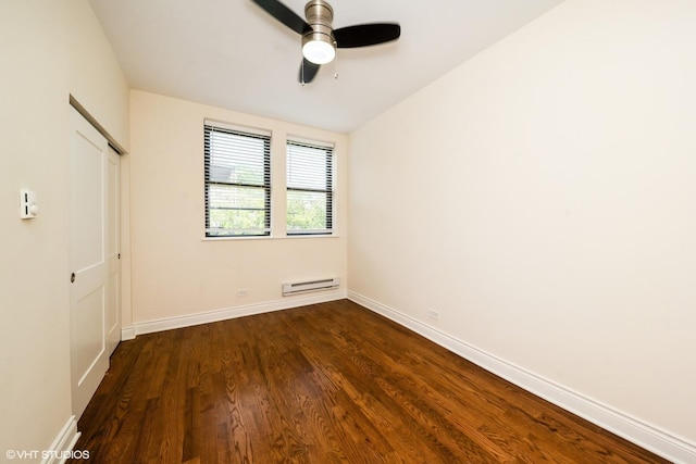 1006 E 54th St Unit J-2, Chicago, IL 60615 - unfurnished bedroom with a baseboard heating unit, dark wood-style flooring, a closet, lofted ceiling, and a ceiling fan