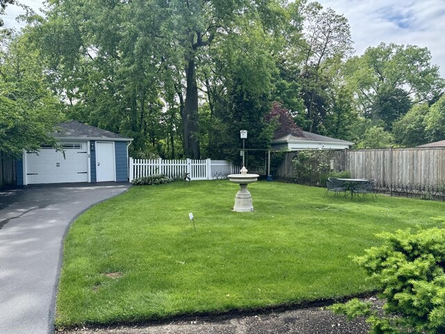 1314 Saint Johns Ave, Highland Park, IL 60035 - view of yard featuring an outbuilding and a detached garage