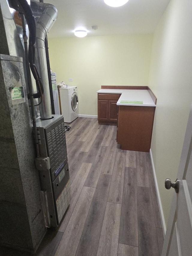 8201 Daniel Dr, Justice, IL 60458 - laundry area featuring washer / dryer, wood finished floors, and cabinet space