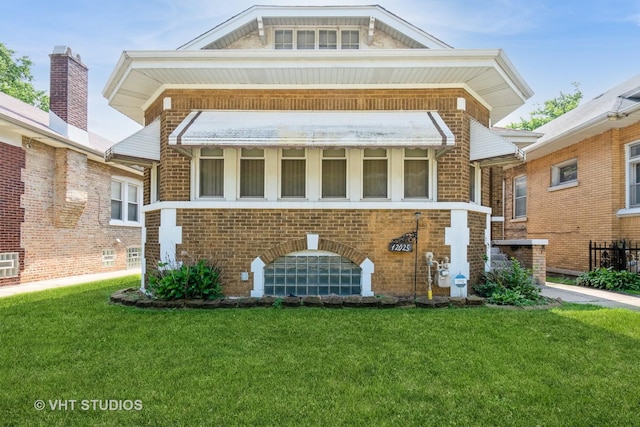 12025 S Harvard Ave, Chicago, IL 60628 - view of front facade with a front yard and brick siding