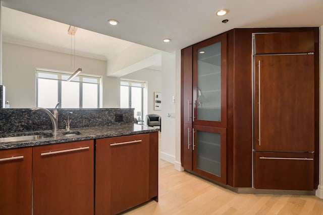 950 N Michigan Ave Unit 4502, Chicago, IL 60611 - kitchen featuring light wood-style floors, crown molding, glass insert cabinets, dark stone countertops, and recessed lighting