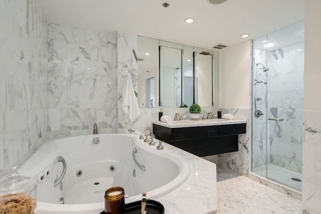 950 N Michigan Ave Unit 4502, Chicago, IL 60611 - full bath featuring a whirlpool tub, a marble finish shower, double vanity, tile walls, and recessed lighting