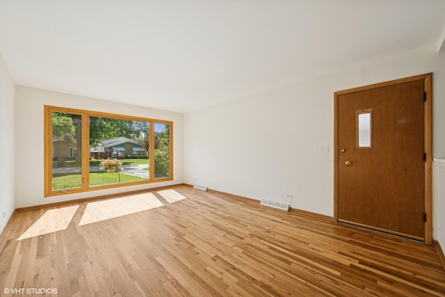 1114 S Mitchell Ave, Arlington Heights, IL 60005 - unfurnished room with wood finished floors and baseboards