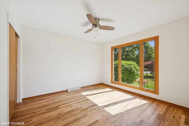 1114 S Mitchell Ave, Arlington Heights, IL 60005 - empty room with light wood-style flooring and ceiling fan
