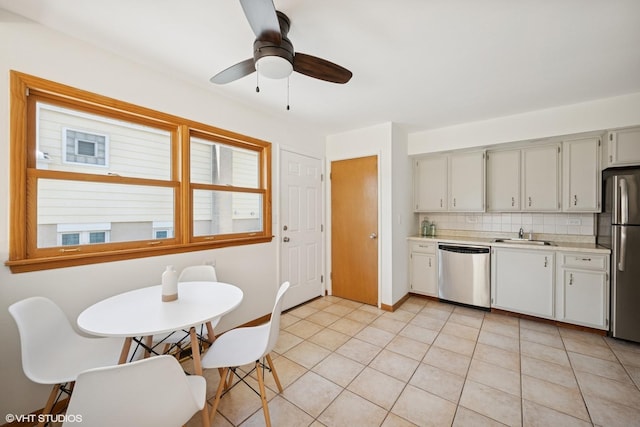 1114 S Mitchell Ave, Arlington Heights, IL 60005 - kitchen with appliances with stainless steel finishes, light countertops, backsplash, light tile patterned floors, and a ceiling fan
