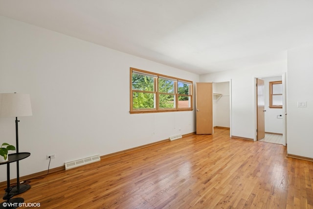 1114 S Mitchell Ave, Arlington Heights, IL 60005 - unfurnished bedroom with light wood-type flooring and baseboards