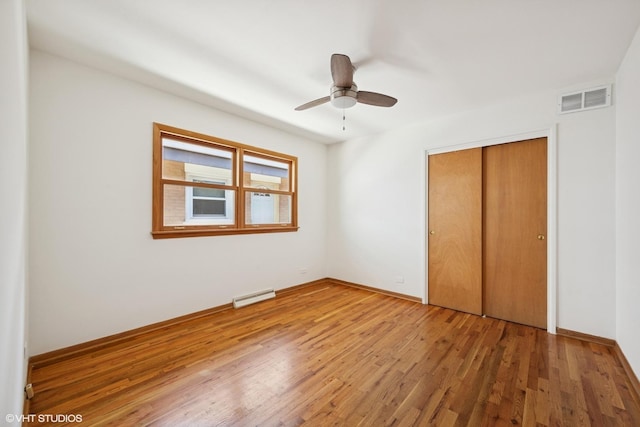 1114 S Mitchell Ave, Arlington Heights, IL 60005 - unfurnished bedroom featuring wood finished floors, a closet, and a ceiling fan