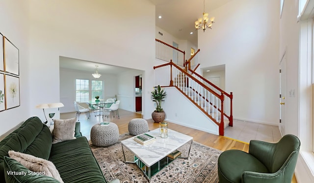 3901 Tallgrass Dr, Champaign, IL 61822 - living area with a high ceiling, stairs, a chandelier, wood finished floors, and recessed lighting