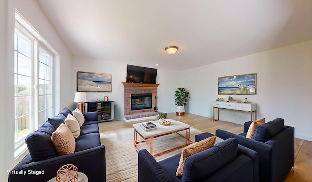 3901 Tallgrass Dr, Champaign, IL 61822 - living room with light wood-style floors and a brick fireplace