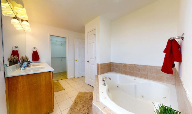 3901 Tallgrass Dr, Champaign, IL 61822 - full bath featuring vanity, a tub with jets, tile patterned flooring, and a spacious closet